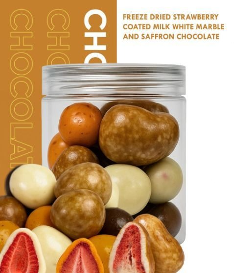 Freeze dried strawberry coated milk marble and saffron chocolate carton